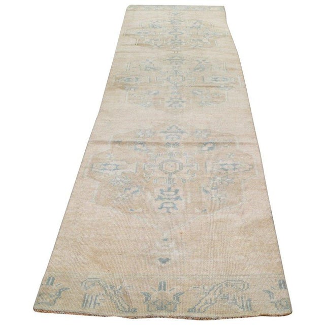 Hand-knotted with care using traditional rug-making techniques, this wool rug blends timeless craftsmanship with a modern...