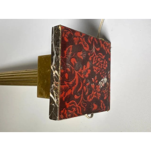 This is a lamp in brass with a marble base. It has been done in France during the 19th Century. It could fit perfectly...