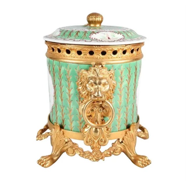 Lovely 20th Century French Gilt Bronze Mounted Porcelain Vessel with Lid. This vessel features fine porcelain...