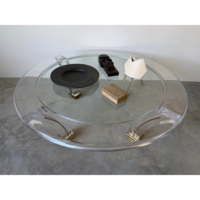 Striking and elegant, this vintage coffee table captures the iconic glamour of Jeffrey Bigelow–style design. The...