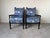 Striking pair of modern accent lounge chairs featuring beautifully turned bobbin spindle frames in a black ebonized...
