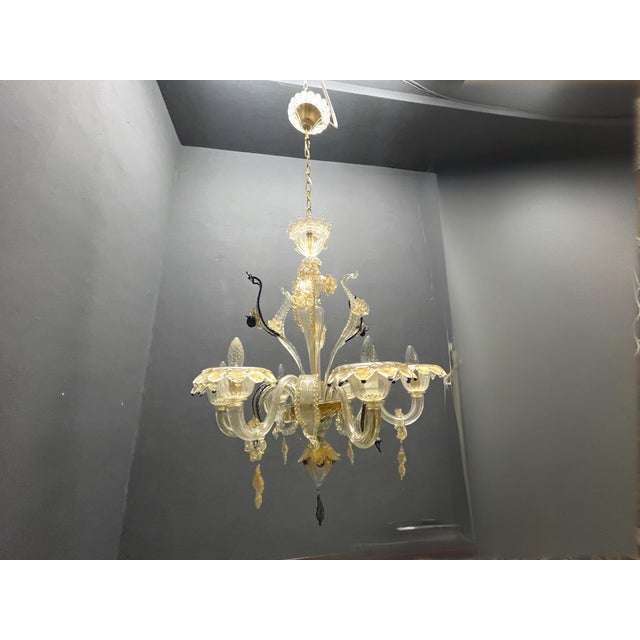 Venetian Murano Glass Chandelier, Italy, 1960s An elegant Venetian Murano glass chandelier handcrafted in Italy during the...