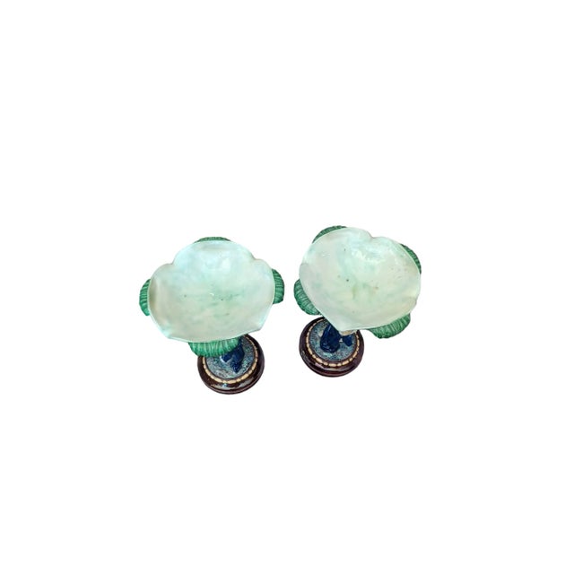 Vintage pair of Majolica pottery cherub compotes. Compote depicts cherubs holding flowers and a wheat Sheath with a palm...