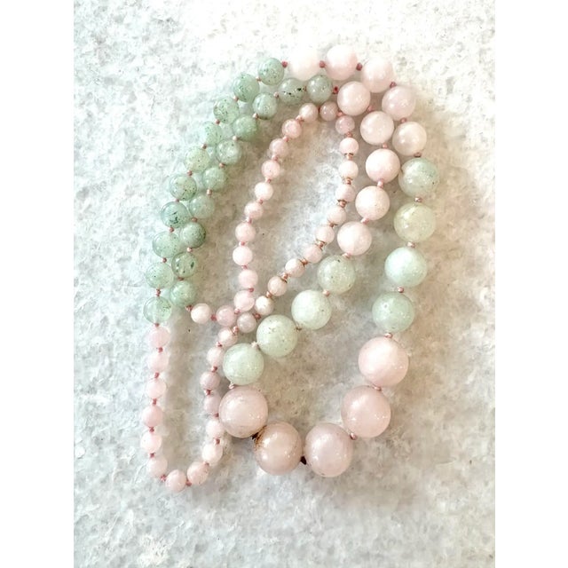 A beautiful two toned hand strung and hand tied beaded necklace made from rose quartz and jade. The milky pink and green...
