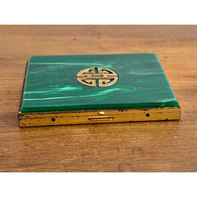 Handsome faux malachite cigarette box. Please see condition details noted. Most items found at Pub & Oasis are vintage and...
