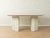 Postmodern dining table from the 1980s by COR. High-quality frame and extendable tabletop with two leaves made of white-...