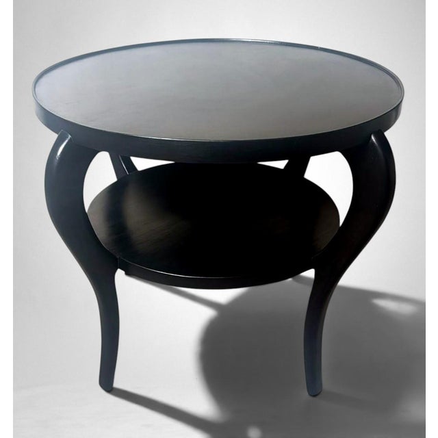 Refined and elegant Italian Art Deco coffee table crafted in ebonized walnut. Distinguished by its clean, balanced lines...
