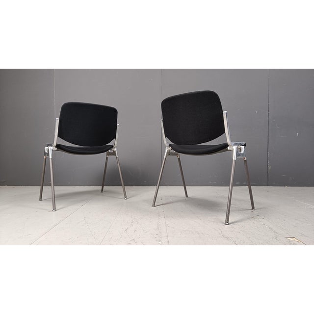 Vintage dining chairs or side chairs designed by Giancarlo Piretti for Castelli. These chairs can be stacked and save up a...