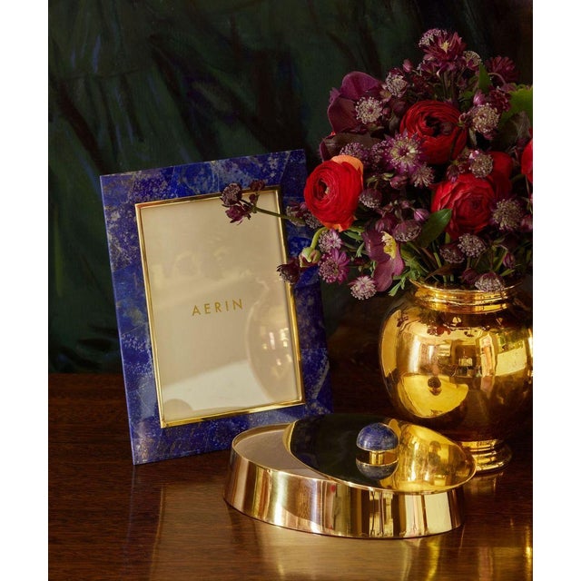 This attractive circular brass box is styled with a subtly tapered base and overhanging lid. It is enhanced with a domed...