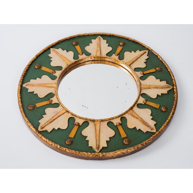 Vintage round mirror in painted and gold gilt wood frame with brass details, the rear of the frame made of chipboard and...