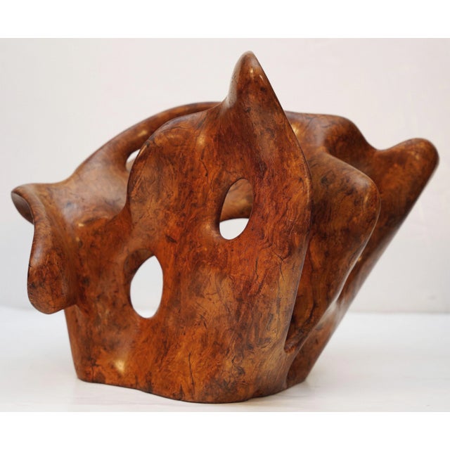 A handsome Mid-Century Modern art sculpture or centerpiece artwork of carved and polished olive wood from France,...