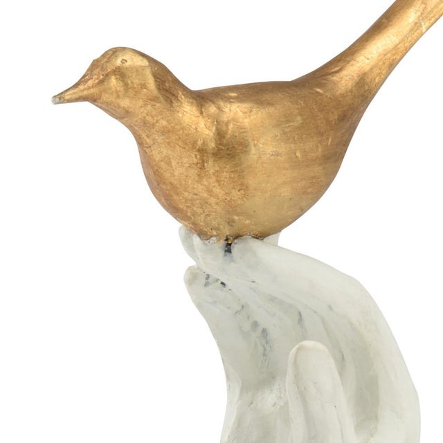 Gold leaf bird with white hand sculpture 11h x 3.5w x 3.5d