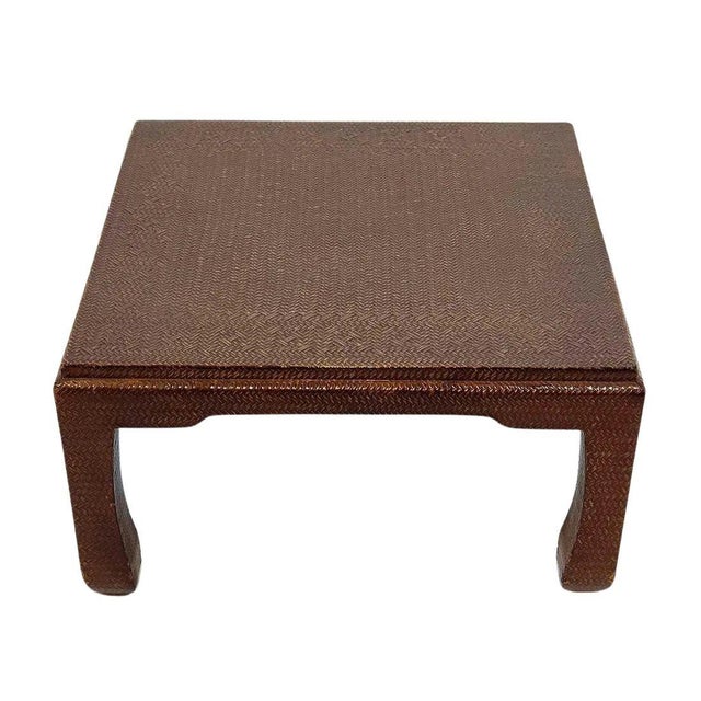 This Karl Springer inspired raffia coffee table blends natural texture with minimalist elegance, featuring lacquered...