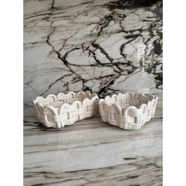 Pair of vintage white handcrafted in Italy ceramic decorative bread fruit baskets. Marked on underside.