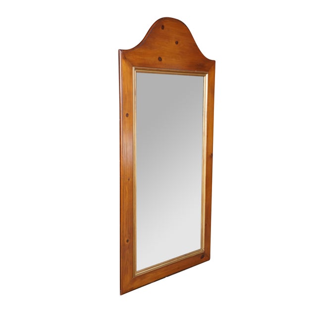 This vintage Early American Colonial style wall mirror is a custom or restored piece by Martino & Sons Inc., a company of...