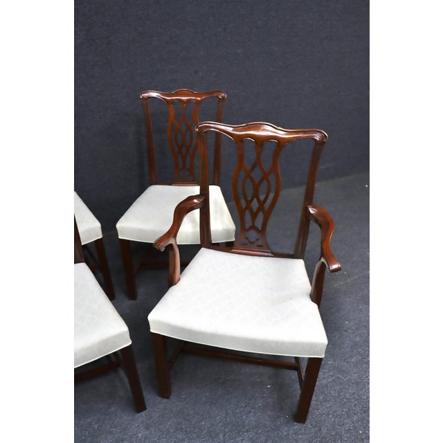 Set of six Hickory Chair Co. Chippendale-style dining chairs, including two armchairs and four side chairs. Crafted in a...