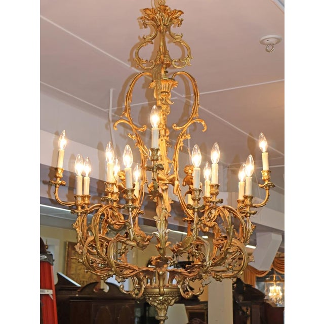 Metal Early 20th Century French Rococo Style Gilt Bronze Putti 16 Light Chandelier For Sale - Image 7 of 18