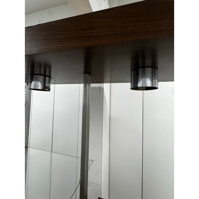This is a Vintage Chrome and Veneer Etagere by Sunrise Design. It is a mid-century modern chrome and faux-wood etagere...