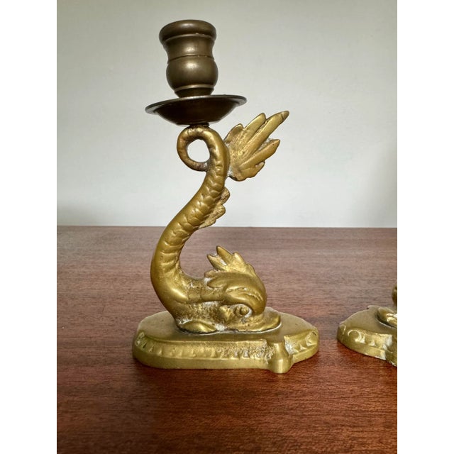 Beautiful Neoclassical brass dolphin candlesticks for anywhere that needs a touch of drama. Please see condition details...