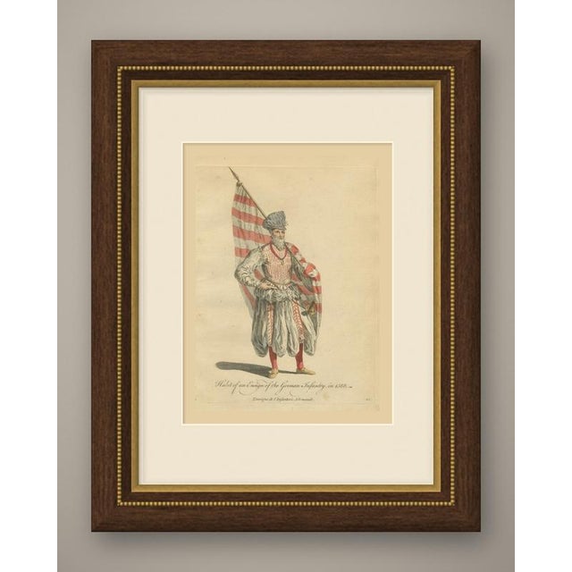 This is an original antique copper engraving with hand coloring, lettered "habit of an ensign of the german infantry, in...