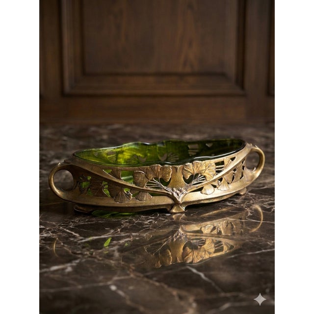 This is a substantial piece with heavy metal (Probably bronze) pierced frame and heavy green glass liner. No major issues...