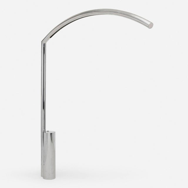 Sculptural floor lamp designed by Nanda Vigo for Arredoluce, featuring a dramatic sweeping aluminum arc supported by a...