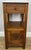 A beautiful Antique French single bedside table, crafted in oak and complemented by an elegant marble top. Featuring one...