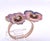 This enchanting antique brooch features a double pansy design, masterfully executed in polychrome enamel on a 14K yellow...