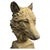 A striking cast stone bust depicting the head of a wolf with strong sculptural detailing and an attractively weathered...