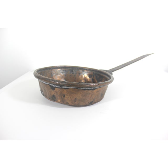 Antique hand forged primitive copper pan with an iron handle. This has so much character, it is perfect for a French style...