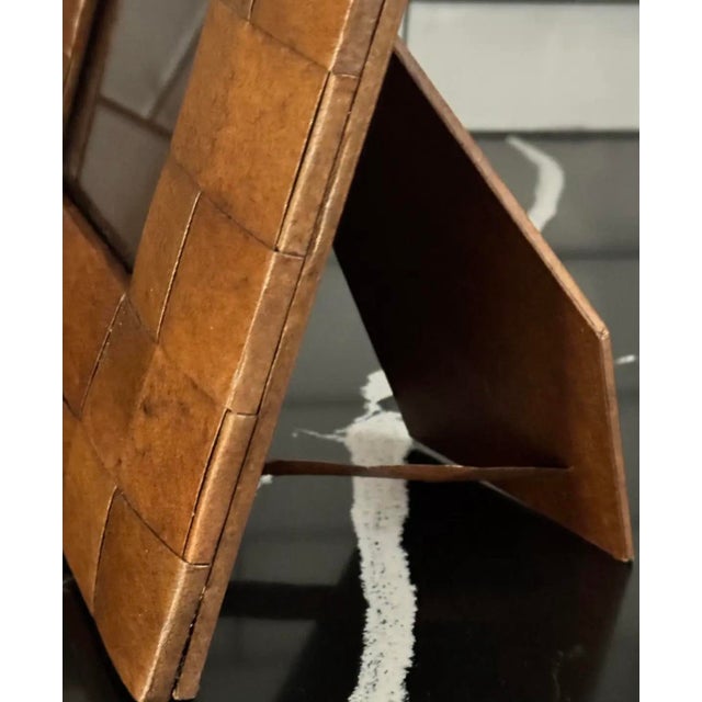 A striking mid-century leather-wrapped frame from the 1960s, crafted in a tessellated pattern that adds depth, warmth, and...