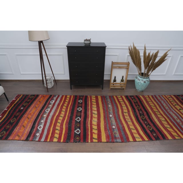 Type: Vintage Flatweave Kilim Runner Origin: Anatolian / Turkish (Handwoven) Technique: Hand-knotted / Handwoven Flatweave...