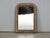A French Louis-Philippe style gilt mirror from the early 20th century, with etched foliage motifs. Created in France...