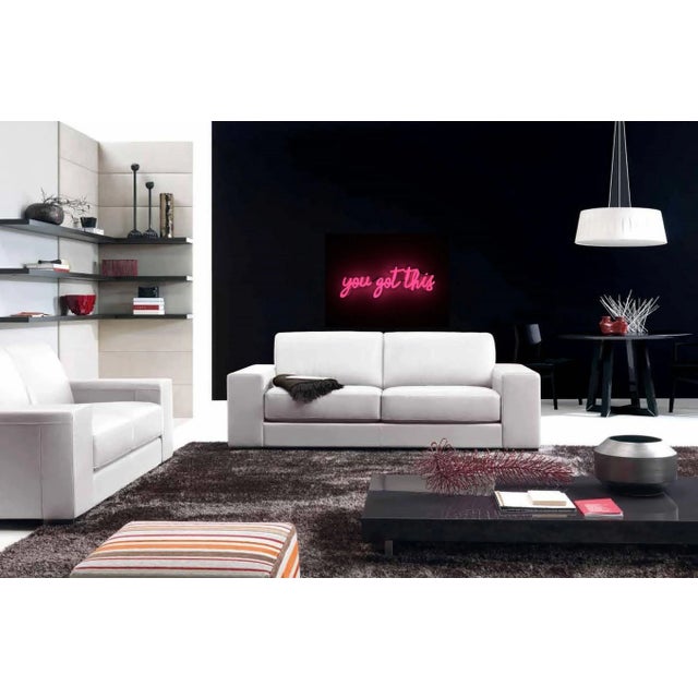 This neon piece is hand blown glass. It is mounted on contoured, clear plexiglas with pre drilled holes for hanging, and...