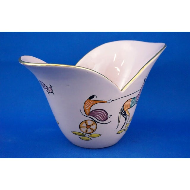 Item : a delightful, unique asymmetrical majolica vase, entirely wheel-shaped, glazed with a rich majolica glaze, and...