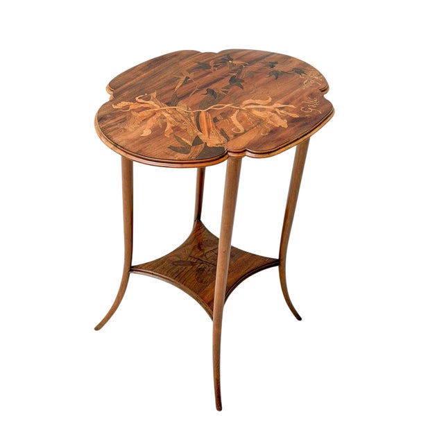 Stunning and elegant Art Nouveau marquetry side table. Design by Émile Gallé Original solid walnut base with four tapered...
