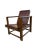 A Pair of Vintage Bamboo Lounge Chairs These beautiful lounge chairs feature a robust, dark-stained bamboo frame,...