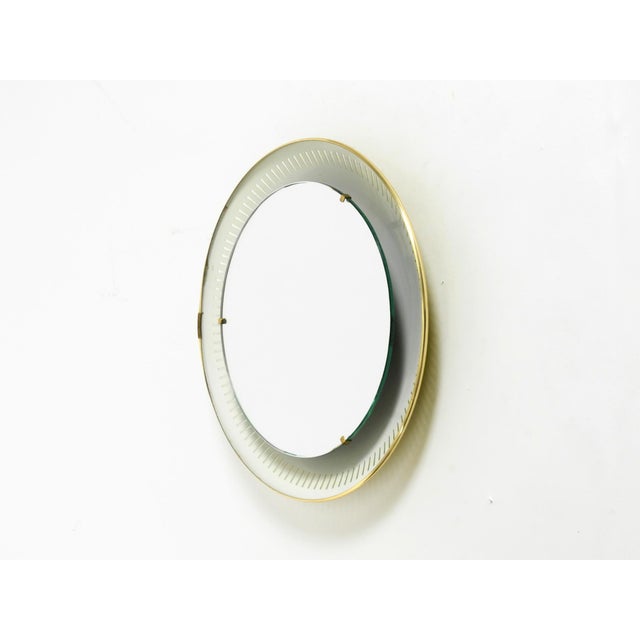 Beautiful round, original Hillebrand metal mirror with backlighting from 1966. Very attractive minimalist 1960s design....