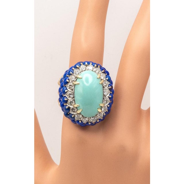 This stunning turquoise lapis lazuli cocktail ring, crafted in 14 Karat yellow gold. The centerpiece features a large...