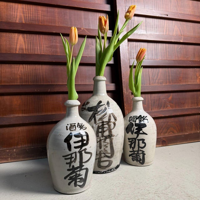 This vintage set of three tokkuri (Japanese sake bottles), dating to around 1940, has that restrained, functional presence...