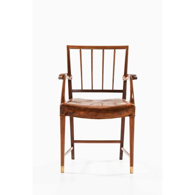 This very rare armchair, designed by jens brøtterup and produced by cabinetmaker jacob kjær in denmark, is a distinguished...
