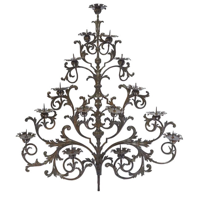 Large Wrought Iron Candle Holder Wall Light, 1700, with 15 flames arranged on an elegant pyramid-shaped iron structure....