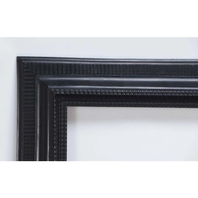 Italian Baroque carved and ebonized wood mirror with 1.5" bevel. Made in Italy in the late 19th Century. Dimensions:...