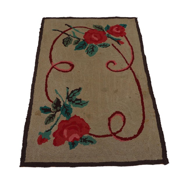 Feel the echoes of early American ingenuity with this hand-hooked vintage rug. Each loop, painstakingly crafted, tells a...