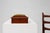 A charming French sewing box from the early 20th century, crafted in polished wood with a textured fabric cushion inset on...