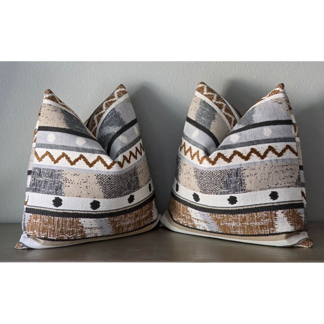 Elevate your living space with the sophisticated warmth of Stroheim Neysa Stripe Caramel Designer Throw Pillows. Crafted...