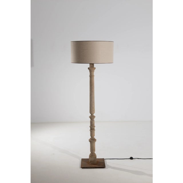 This oak floor lamp was produced in France during the turn of the century. Elevated to nearly six feet, this tall lamp...