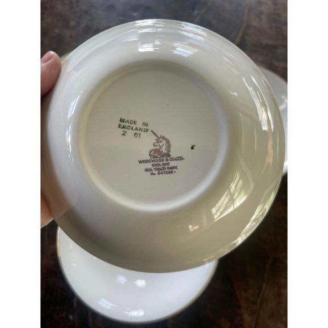 Lovely set of four bowls by Wedgwood presented in a creamy ivory with a burst of pink in the bouquet in the center of each...