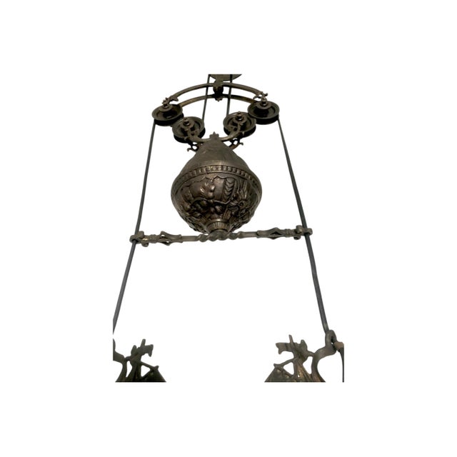 This striking vintage chandelier features a sculptural nautical-inspired design with elegant ship motifs, making it a true...