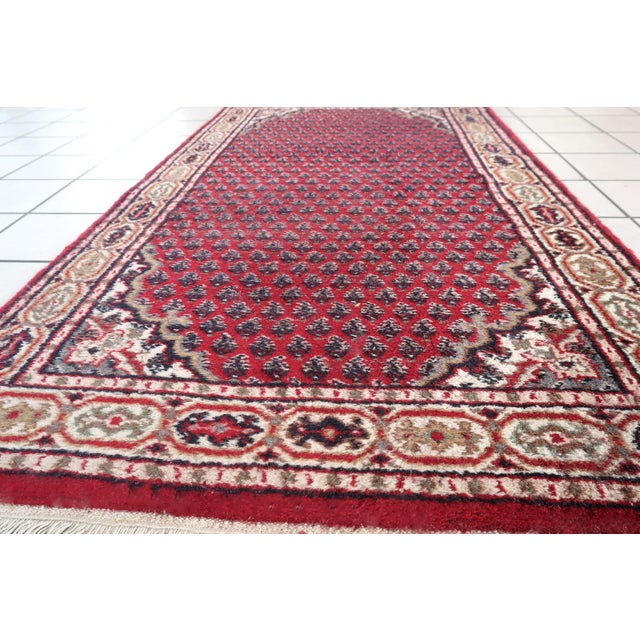 Handmade vintage Indian Seraband rug in traditional all-over design. The rug is form the end of 20th century in original...